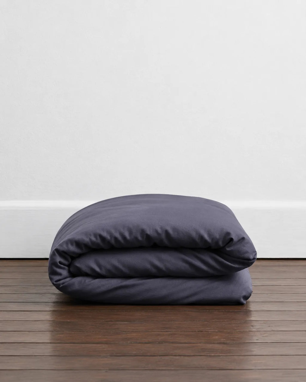 A folded Ash Grey Duvet, from saanjh homes. 100 cotton, super soft and ultra premium. 