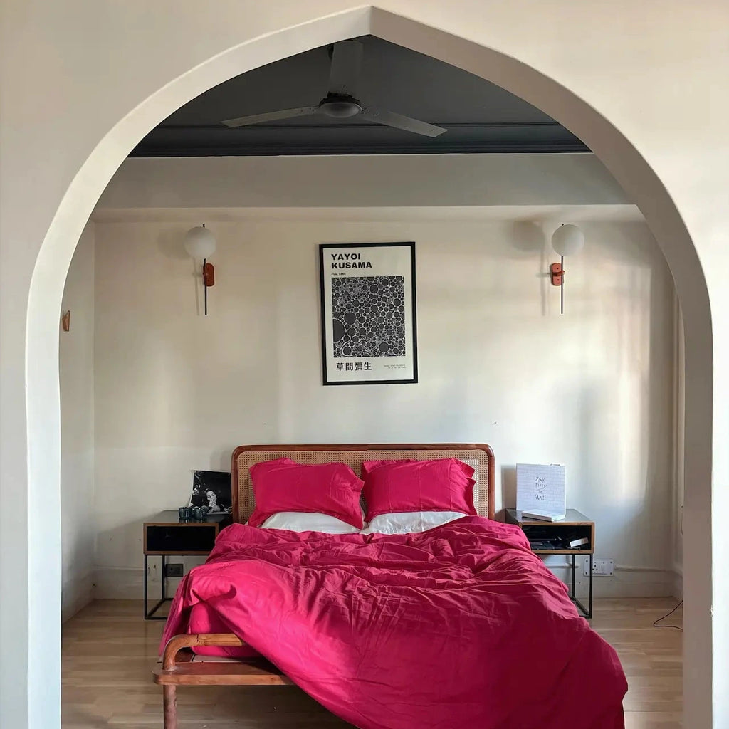 Bedroom with Lingonberry pink bedding and framed wall art — 300 TC fitted sheet, Saanjh Homes