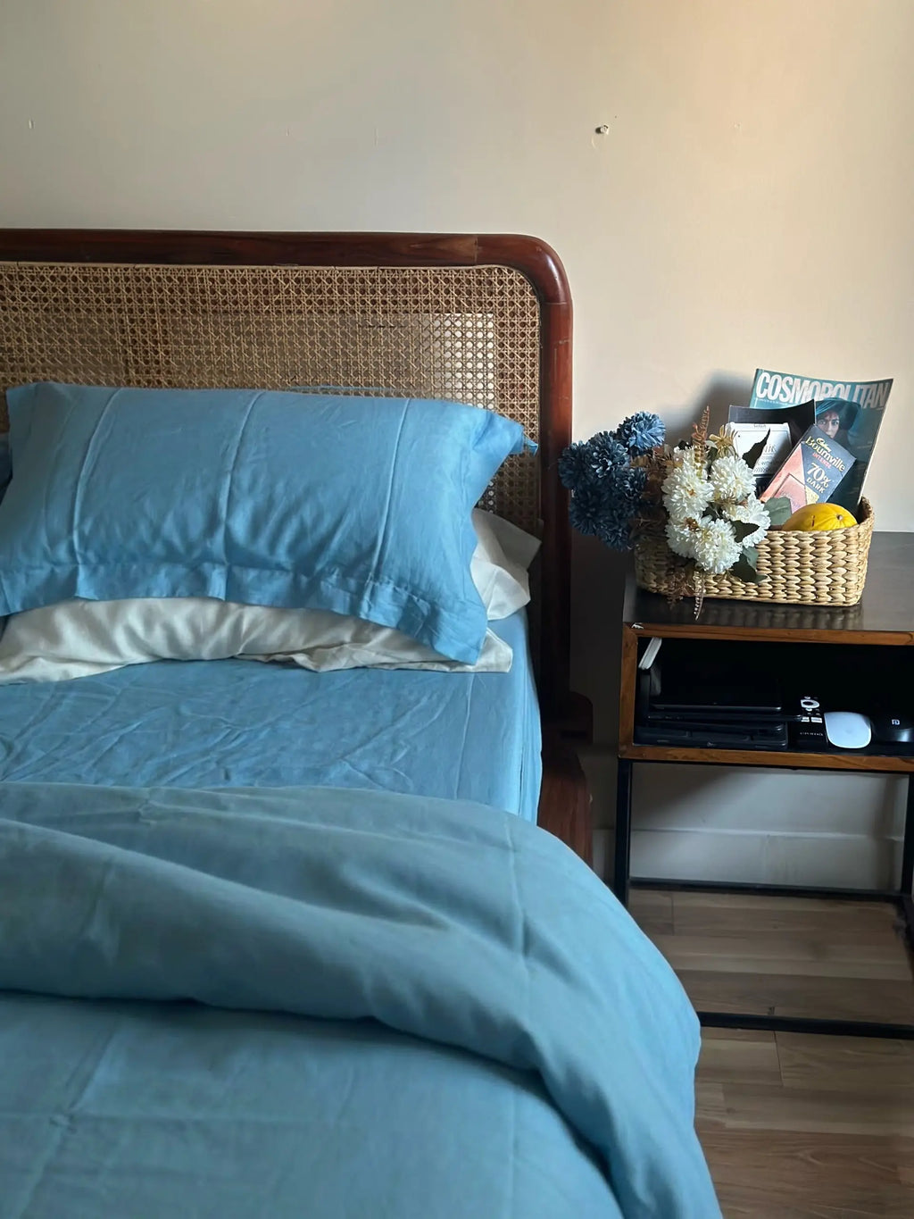 Soft Nimbus blue fitted bedsheet with wicker headboard — Shaam Saahil, Saanjh Homes