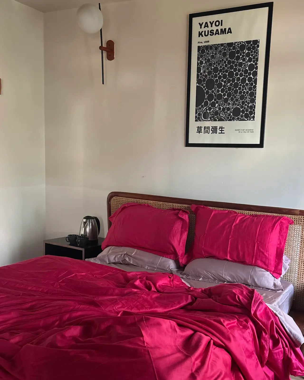 Bedroom with pink bedding and a framed poster on the wall, by Saanjh Homes