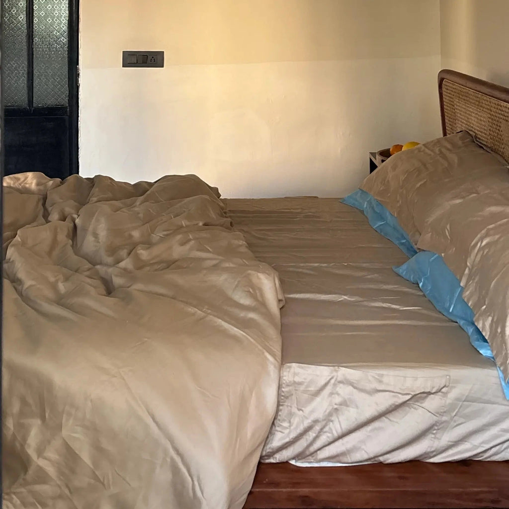 Bedroom with beige bedding 